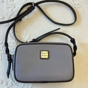 New without tags.Color smoke. Dooney and Bourke Loni Crossbody bag.